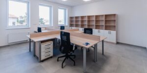 small new empty office space with desks and chairs - commercial casework