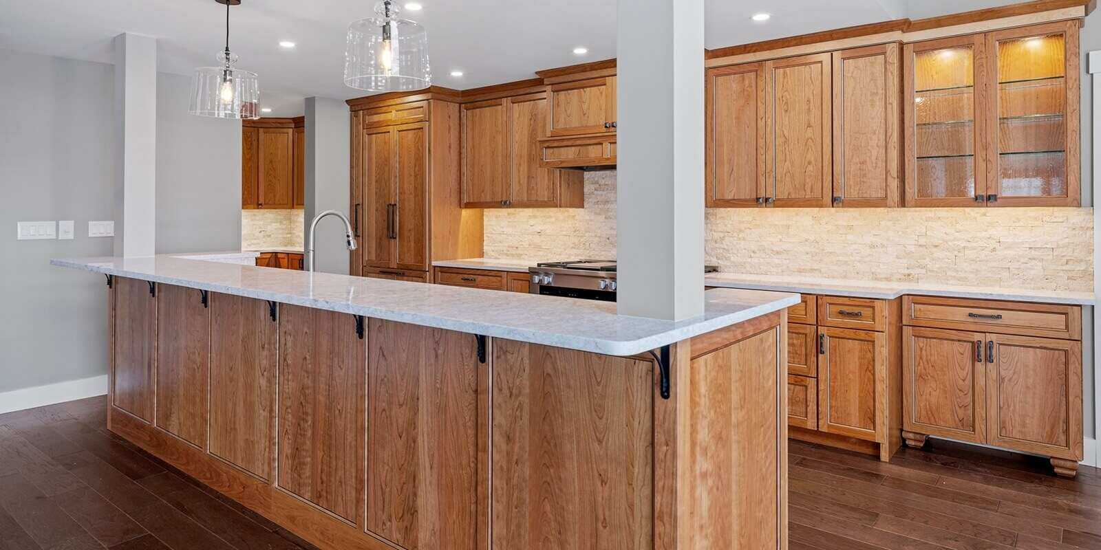 modern kitchen featuring beautiful wooden cabinets with a sleek